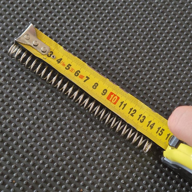 Measuring a spring's free length with a tape measure